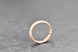 A 9ct rose gold wedding band, size P and approx 5.1g
