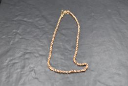 A 9ct rose gold belcher chain with safety chain, approx 18' & 7g
