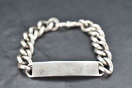 A gent's silver identity bracelet bearing worn monogram, approx 47.2g