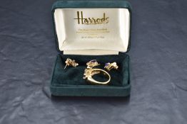 A yellow metal suite of jewellery stamped 14K comprising of stud earrings, ring and pendant, all