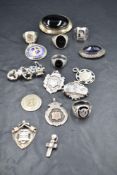 A selection of silver jewellery including football medalions, St Christopher pendant, brooches and