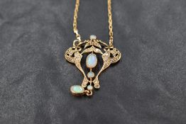 An Italian 9ct gold diamond and opal pendant and chain, of Edwardian style and set with sixteen