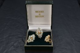 A 14k gold diamond and opal cluster ring and earring set, the ring having three small central
