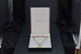 A large split pearl pendant having an 18ct gold mount set with diamond chips on a long 14ct gold