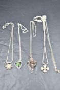 Four silver & white metal pendants with chains including filigree, and a separate chain