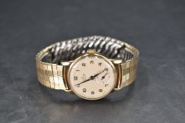A gent's 9ct gold wrist watch by Smiths having Arabic numeral dial with subsidiary seconds to