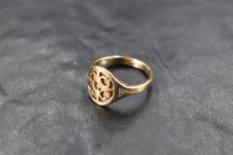 A 9ct gold signet ring with overlaid cut panel, size P & approx 4.4g