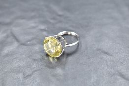 A large Ouro Verde solitaire ring in a four claw set basket mount on a 9ct white gold loop, size N/O
