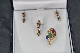 A 9ct gold pendant with matching earrings having ruby and diamond chip decoration, and a seperate