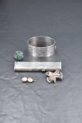 Five pieces of HM silver & white metal including a hinged bangle having engraved scroll