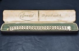 A 9ct gold two tone articulated brick link bracelet having concealed clasp, approx 170mm long & 22g