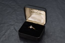 A diamond solitaire ring, approx 0.5ct in a four claw setting to knife blade shoulders on an 18ct