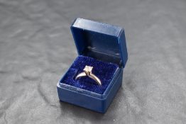 A diamond solitaire ring, approx 0.35ct in a four claw raised mount on an 18ct white gold loop, size