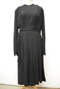 A 1930s textured wool day dress having full length sleeves gathering into a fitted cuff, pleated