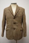 A gents 1950s/60s Harris tweed jacket in green, brown and cream hues.