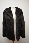 A vintage Coney fur coat, medium size.