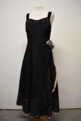 A 1950s black grosgrain evening dress having pink accents and deep lace to hem, AF.