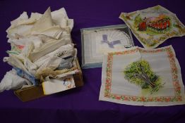 An extensive collection of vintage and antique handkerchiefs, including novelty and souvenir
