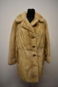 A 1960S blonde mink jacket, having half belt to back with button detail and label for Wild and Smith