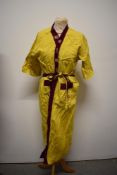 A Chinese dressing gown, having machine embroidered dragon design to back.