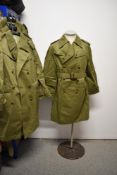 Four vintage military or military style coats, olive green cotton with brown buttons and buckles,
