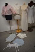 A mixed lot of underwear, nightwear and a swimming costume, bed jackets, slips and nylon knickers