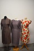 Three vintage dresses, comprising; late 1940s cotton dress with Peter pan collar and button down