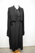 A 1930s black textured crepe day dress, having draped collar, integrated modesty panel, full