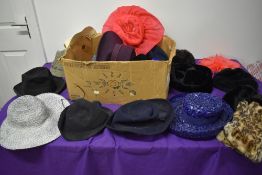 A mixed lot of hats, knitwear and a pair of fur gloves, various styles and eras.