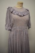 A 1940s red and blue checked fine cotton day dress, with ruffled neckline, 3/4 sleeves and button f
