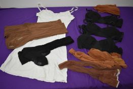 A selection of vintage stockings and bras, including unworn black cc41 seamed pair in rayon or