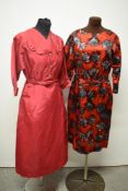 A late 1940s cerise taffeta dress having amazing novelty buckle details to shoulders, pockets to