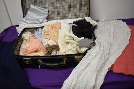 A suitcase of mixed vintage and antique clothing and nightwear, wear throughout, for repair of