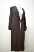A 1930s brown crepe coat, having deep shaped collar and button fastening.