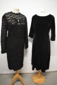Two 1950s day dresses, one of black velvet having scalloped neckline and cuffs with side metal