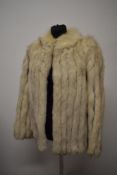A 1980s fox fur jacket having interspersed slate grey suede bands.