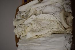 A box of vintage and antique table linen and similar, included are crocheted, embroidered and cut