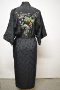 A vintage kimono dressing gown, having colourful machine embroidered scene to back and similar to