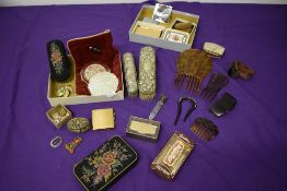 A miscellany of vintage and antique items, compacts, brushes (including hallmarked silver) hair