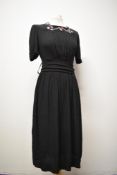 A 1940s embroidered crepe CC41 Utility day dress, having floral detail to yolk, buttons to nape (two