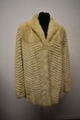 A vintage 1960s/ 1970s blonde mink jacket, having herringbone like pattern.