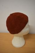 A 1930s red soft Nubuck/ suede skull cap, 'A Jacoll hat, made in England'.