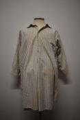 An early 20th century gents striped nightshirt.