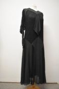 A 1920s bottle green semi sheer crepe and black lace panelled 1920s dress, having no fastening bar