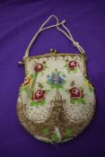 An early 20th century beaded evening bag, having metal frame.