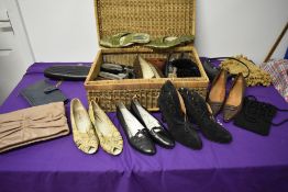 A vintage wicker hamper containing a variety of shoes and bags, to include Miu Miu clutch bag, Hobbs