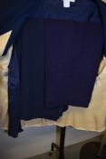 A selection of vintage and retro clothing, mixed sizes, colours and styles.