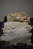 A collection of antique and vintage table linen, to include drawn thread work, crotchet edged