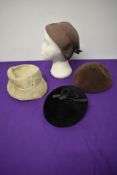 Four vintage 1950s hats, various styles and colours.