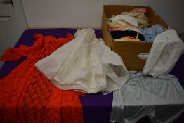 A box of mixed vintage lingerie,including petticoats, nylon slips, camisoles, nightdresses and